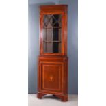 An Edwardian Mahogany Two-Tier Corner Cupboard, inlaid with satinwood bandings and stringings, the