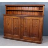 A Victorian Pitch Pine Cabinet, the upper part with moulded cornice, fitted one open shelf, the base
