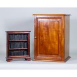 A Walnut Collector's Cabinet, fitted two short and five long drawers, enclosed by a single panel