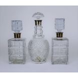 A Pair of Elizabeth II Silver Mounted and Glass Square Spirit Decanters, One Other Decanter, and Two