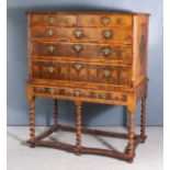 A William and Mary Walnut and Olive Wood Oyster Veneered and Crossbanded Chest on Stand, the quarter