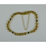A Sapphire and Diamond Bracelet, Modern, 18ct gold flat link bracelet set with four small faceted