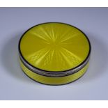 An Early 20th Century Swiss Silver and Yellow Enamel Circular Box, stamped 935 sterling, with