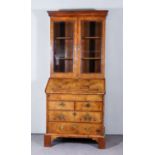 A George II Walnut Bureau Bookcase, the slope and drawer front with matched figured veneer panels