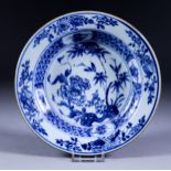 A Chinese Blue and White Porcelain Circular Plate, Kangxi Period, painted with peony and bamboo amid