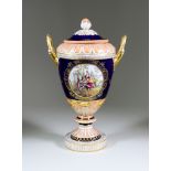 A Berlin Porcelain Two-Handled Vase and Cover (Late 19th Century), painted with two Watteauesque