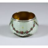 An Early 20th Century Silver, Silver Gilt and White Enamel Circular Salt, hallmarks rubbed, the