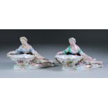 Two Meissen Porcelain Salts, modelled as reclining female figures holding dishes of shaped