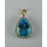 A Blue Topaz and Diamond Tear Drop Pendant, Modern, bi-coloured metal set with a centre teardrop