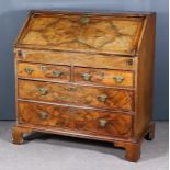 A Mid 18th Century Walnut and Oak Sided Bureau, the top and front inlaid with herringbone