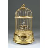 A Swiss Reuge Musical Bird in a Gilded Cage Automaton, No. 5272, 11ins high, with turned hardwood