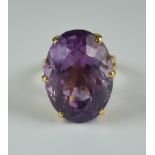 A Large Faceted Amethyst Ring, Modern, 18ct set with a large faceted amethyst stone, size O, gross