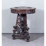 A 19th Century Burmese Hardwood Circular Table, the top carved with a band of scroll work and with