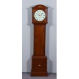 A 19th Century Oak Longcase Clock by Charles Frodsham, the 12ins cream painted dial with Roman