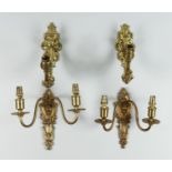 A Pair of Cast Brass Twin Wall Lights, 20th Century, with plain arms, the back plate with a tied