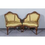 A Pair of 19th Century French Walnut Tub Shaped Low Armchairs, the moulded frames with scroll carved