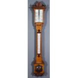 A Late Victorian Oak Cased Stick Barometer and Thermometer, with glass scale and twin vernier and