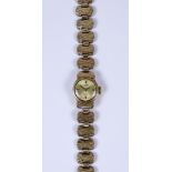 A Lady's Rotary Manual Wind Wristwatch, 9ct gold case, 14mm diameter case, with gold coloured face