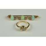 An Opal and Diamond Bar Brooch, Early 20th Century, 9ct gold set with three opals and two small