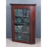 An Edwardian Mahogany Hanging Corner Cupboard, the whole inlaid with chequered stringings, with