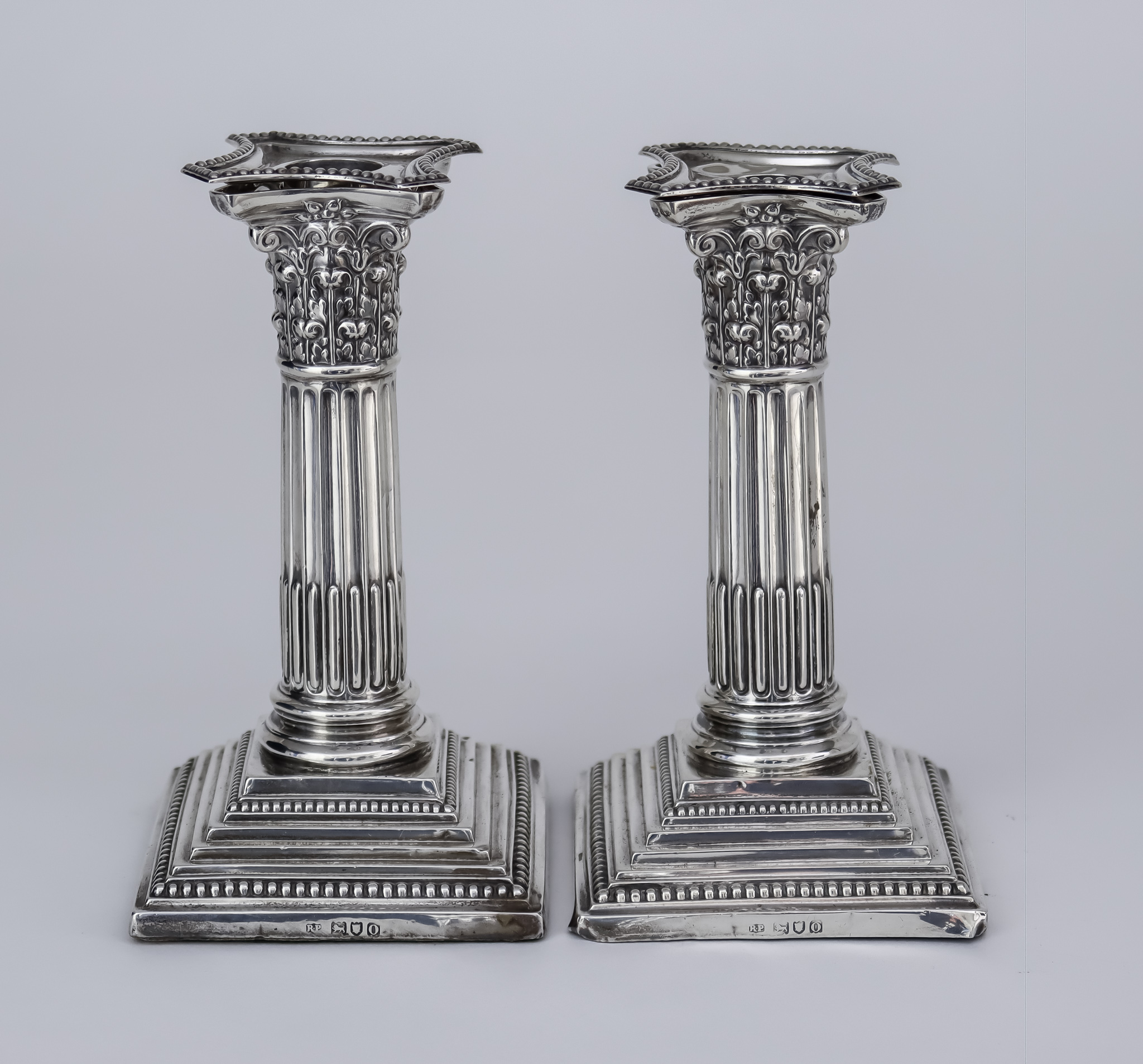 A Pair of Edward VII Silver Pillar Candlesticks, By Robert Pringle & Sons, London 1909, with