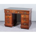 A Victorian Mahogany Kneehole Desk, with moulded edge to top and green leather inset, with three