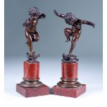 19th Century Continental School - Pair of brown patinated bronze figures of putti, each standing