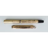 A Waterman's 9ct Gold Cased Fountain Pen and a 9ct Gold Cased Pencil, the fountain pen engraved "