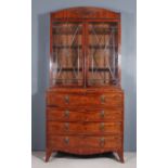 A George III Mahogany Secretaire Bookcase, inlaid with ebonised bandings, the upper part with arched