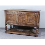 An Old Oak Panelled Side Cabinet, with moulded edge to top, cupboard enclosed by a pair of