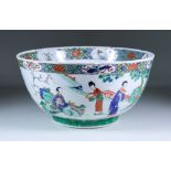 A Chinese Famille Vert Porcelain Punch Bowl, Early 18th Century, enamelled in colours with figures