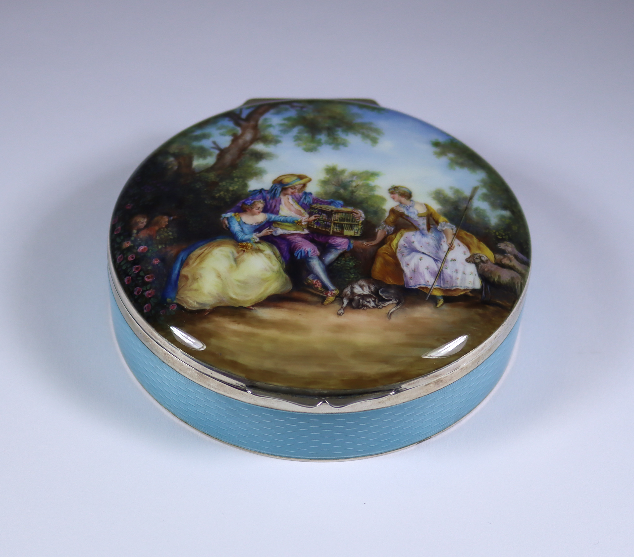 An Early 20th Century Continental Silver Gilt and Enamel Circular Box, with import marks for P.H.