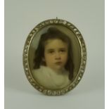 A Diamond Set Oval Brooch, Early 20th Century, yellow metal, inset with a portrait of a young