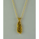 A Gold Nugget, Modern, in the form of a pendant, 29mm x 11mm, (8.2g) with fine chain necklace, 410mm