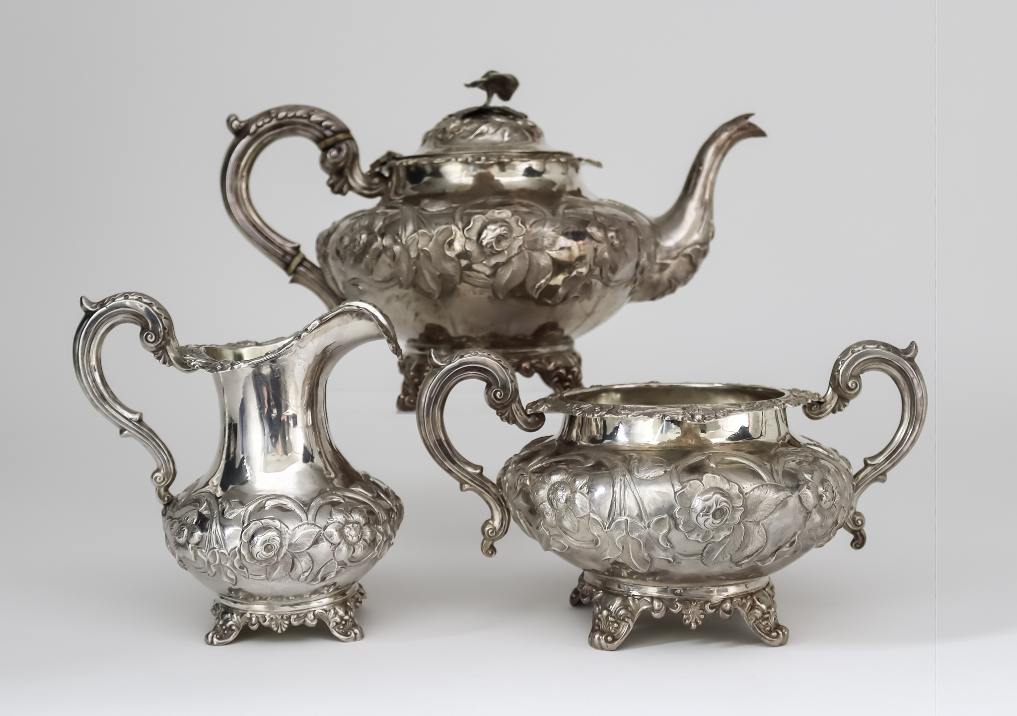 A Victorian Silver Circular Three Piece Tea Service, by William Hunter, London 1845, of compressed