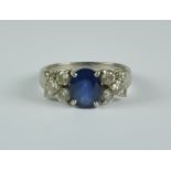 A Sapphire and Diamond Ring, Modern, 18ct white gold set with a centre sapphire approximately 1.5ct,