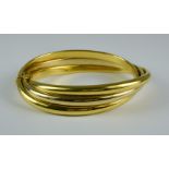 An 18ct Triple Hoop Bangle, Modern, 210mm circumference, gross weight 38.5g