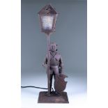 A Bronzed Metal Table Lamp by Hugo Berger for Goberg, 1920s, modelled as a standing knight in armour