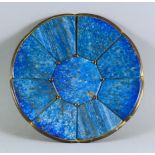 A Continental Gilt Metal and Polished Lapis Lazuli Dish, 19th Century, with eight shaped panels