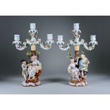 A Pair of Sitzendorf Porcelain Three-Light Candelabra, Late 19th/Early 20th Century, modelled as