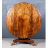 An Early Victorian Figured Mahogany Circular Breakfast Table, the butterfly veneered top on turned