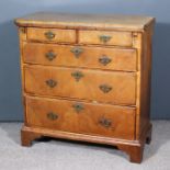 A Mid 18th Century Walnut Bachelor's Chest, the baize lined folding top and drawer fronts inlaid