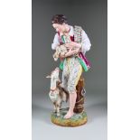 A Continental Porcelain Standing Figure, Late 19th Century, of a young man with a kid in his arms,