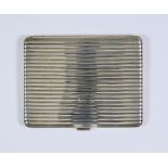 An Austrian Silvery Metal Rectangular Silver Cigarette Case, or reeded form, 4.25ins x 3.375ins,