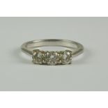 A Three Stone Diamond Ring, Modern, 18ct white gold set with three brilliant cut white diamonds,