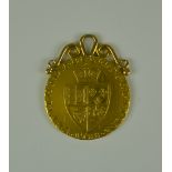 A George III 1788 Spade Guinea, with attached yellow metal mount, total gross weight 9g