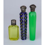 Three Late 19th Century / Early 20th Century Silvery Metal Topped and Cut Glass Scent Bottles, one