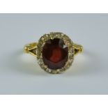 A Ruby and Diamond Ring, 20th Century, 18ct gold set with a centre ruby, approximately 3ct,