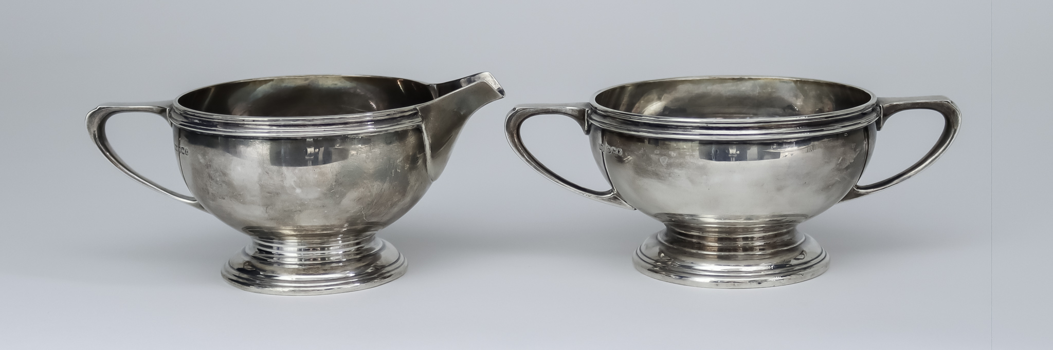 A George VI Silver Circular Two-Handled Sugar Basin and Matching Milk Jug, by Mappin & Webb,