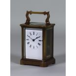 An Early 20th Century French Lacquered Brass Carriage Timepiece, the white enamel dial with Roman